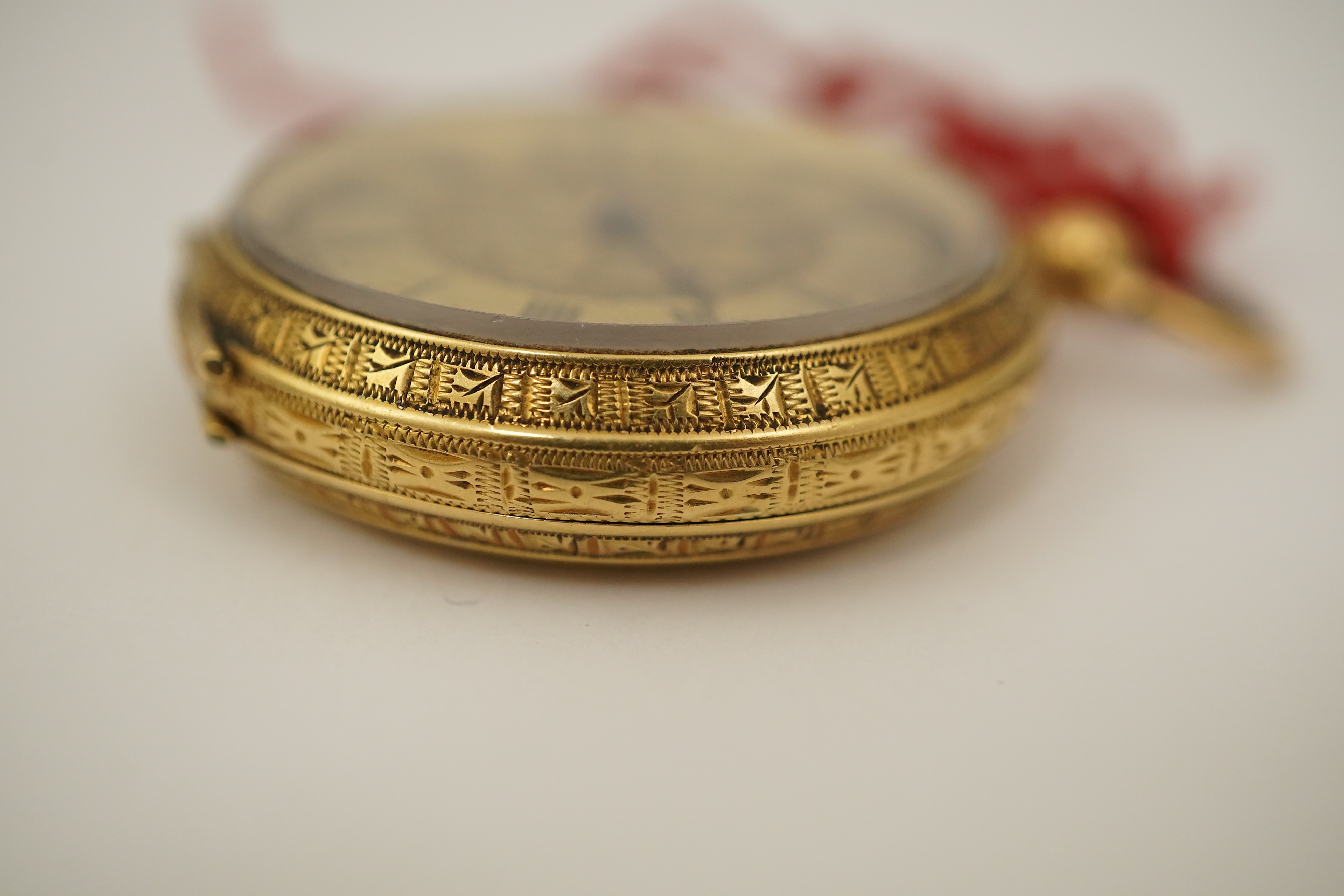 An early 20th century continental engraved 18k gold open faced fob watch